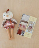 Clarence Chicken Doll lying next to boxed kit