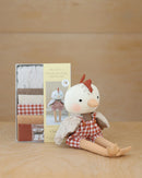 Clarence Chicken Doll sitting next to boxed kit