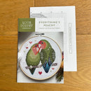Everything's Peachy Cross Stitch chart and Pattern cover with two birds and a leaf on a wooden surface.