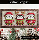 Festive Penguins Cross Stitch Pattern on wooden background