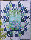 Grand Central - At the Pond quilt hanging in garden.
