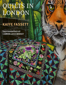 Book cover of 'Quilts in London' by Kaffe Fassett with a tiger mural in the background.