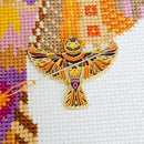 Mandala Sparrow Enamel Needle Minder on cross-stitch design.