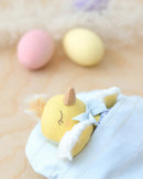 Mini Robin Chick Doll tucked in blue bed