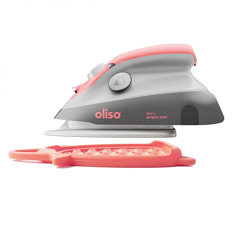 Oliso Mini Iron With Trivet Coral Color Sitting on Trivet M3PRO-CORAL