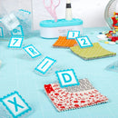 Alphaclippies holding fabric precuts on blue cutting mat.