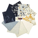 Arabesque and Friend Fat Quarter Bundle shows a fan arrangement of multiple fabric fat quarters in assorted prints and colors, including navy floral, cream floral with yellow accents, blue-gray speckled, cream speckled, and a central white card with a dragonfly illustration.