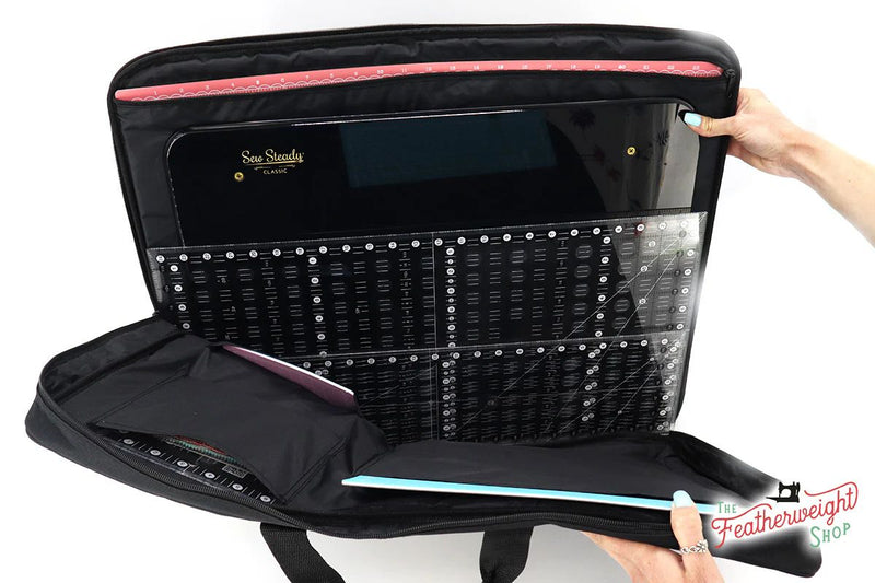 Inside of bag for Featherweight Sew Steady Extension Table showing ruler, table, and mat storage.