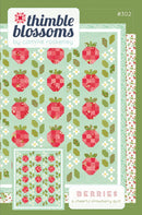 Berries quilt pattern has strawberries and flowers on mint background.