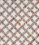 Colorful quilt with a geometric pattern from Bonnie Hunter's Scrap-Savvy Quilting