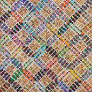 Multicolored quilt with various patterns and colors from Bonnie Hunter's Scrap-Savvy Quilting