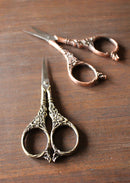Botanical Garden Scissors in Antique Finish on wooden surface.