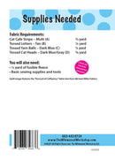 A white informational sheet titled 'Supplies Needed' with blue polka-dot header accents, listing fabric requirements and sewing supplies for a Cafe Kitty Tote. Visible text includes 'Cat Cafe Stripe - Multi (A)', 'Tossed Letters - Tan (B)', 'Tossed Yarn Balls - Dark Blue (C)', 'Tossed Cat Heads - Dark Blue/Gray (D)', a pink circular callout, a barcode, and contact information for The Whimsical Workshop.