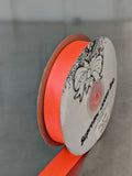 Spool of orange ribbon with a brand label on a gray background. Double-Face Satin Ribbon 22mm (.875") Wide