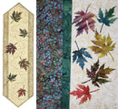 Easy Breezy Maple Leaf Table Runner Kit shows batiks fabrics and precut leaves as well as finished tablerunner.