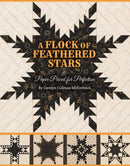 A Flock of Feathered Stars book cover shows pieced feathered stars on beige backgrounds.