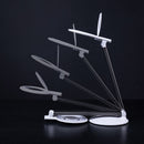 Halo Go 2 Rechargeable Table Light and Magnifier in various positions as it is folded down flat.