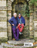 A book cover of Kaffe Fassett's Quilts at an English Manor House featuring a photograph of two people sitting in a stone archway and a barcode at the bottom right.