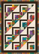 Make it Scrappy with 3-Yard Quilts Colorful geometric quilt with a black border and a multicolored print.