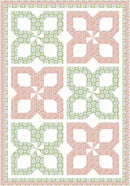 Make it Scrappy with 3-Yard Quilt pattern with butterfly shapes in pink, green, and white on a light background