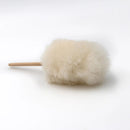 Sheepskin mini duster on white background.