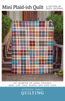 Mini Plaid-ish Quilt pattern cover shows a plaid design quilt in front of a staircase.