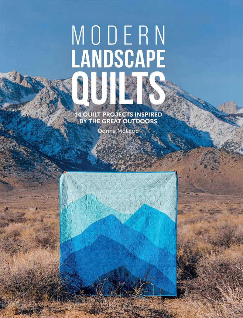 Book cover of 'Modern Landscape Quilts' with a mountain landscape and blue quilt.