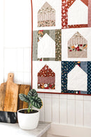 Pattern from "Not Your Typical Jelly Roll Quilts" shows envelopes of a quilted wall hanging.
