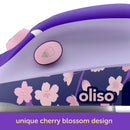 Oliso Mini Project Iron With Solemate Yaya Han styling shows purple oliso iron with cherry blossom design on a white background