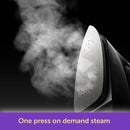 Steam from  Oliso Mini Project Iron With Solemate Yaya Han on a dark background