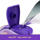 Oliso Mini Project Iron With Solemate Yaya Han styling shows iron with open cap being filled with water on a white background