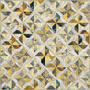 Patchwork on the wind quilt with geometric pattern in yellow and neutral colors.