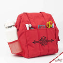 Padded Red Travel Bag for Singer Featherweight 221 & 222 shown with items in outer pockets.