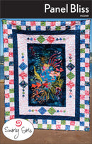 Quilt with colorful border and central design, featuring 'Swirly Girls' brand and pattern name of "Panel Bliss".