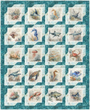 A quilt from Panel Pizzazz 3-Yard Quilts featuring a grid of 20 ocean-themed animal and sea life illustrations, including sharks, dolphins, a seahorse, a crab, a turtle, and a lobster, arranged in a diamond-patterned quilt design with a teal and white border.