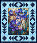 A square quilt pattern from Panel Pizzazz 3-Yard Quilts showing a fabric panel of a stained-glass style floral design with three blue and purple flowers, surrounded by a geometric border in light blue and dark navy.