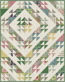 Path Park Quilt  with geometric pattern featuring triangles and floral designs in pastel colors.