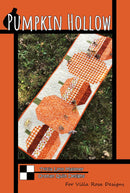 Pumpkin Hollow quilted table runner pattern cover depicts 4 pumpkins in a row.