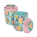 Quilty Clips - 100 Count In Decorative Tin- Aqua shows a set of floral tin canisters with checkered lids on a white background, with clips in one tin.