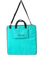 Turquoise Sew Steady Create Bag with a handle and strap on a white background.
