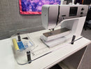 Sewing machine on a table with the Sew Steady Custom Large Deluxe 2.0 Extension Table.