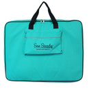 Turquoise Sew Steady Elevate Bag with black handles and Sew Steady logo on a white background