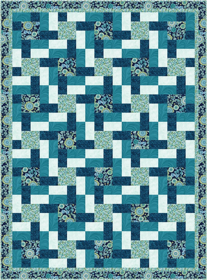 Quilt with blue and white geometric pattern from the Step it Up with 5-Yard Quilts book.