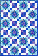 Quilt with blue and purple star pattern on a white background from the Step it Up with 5-Yard Quilts book.