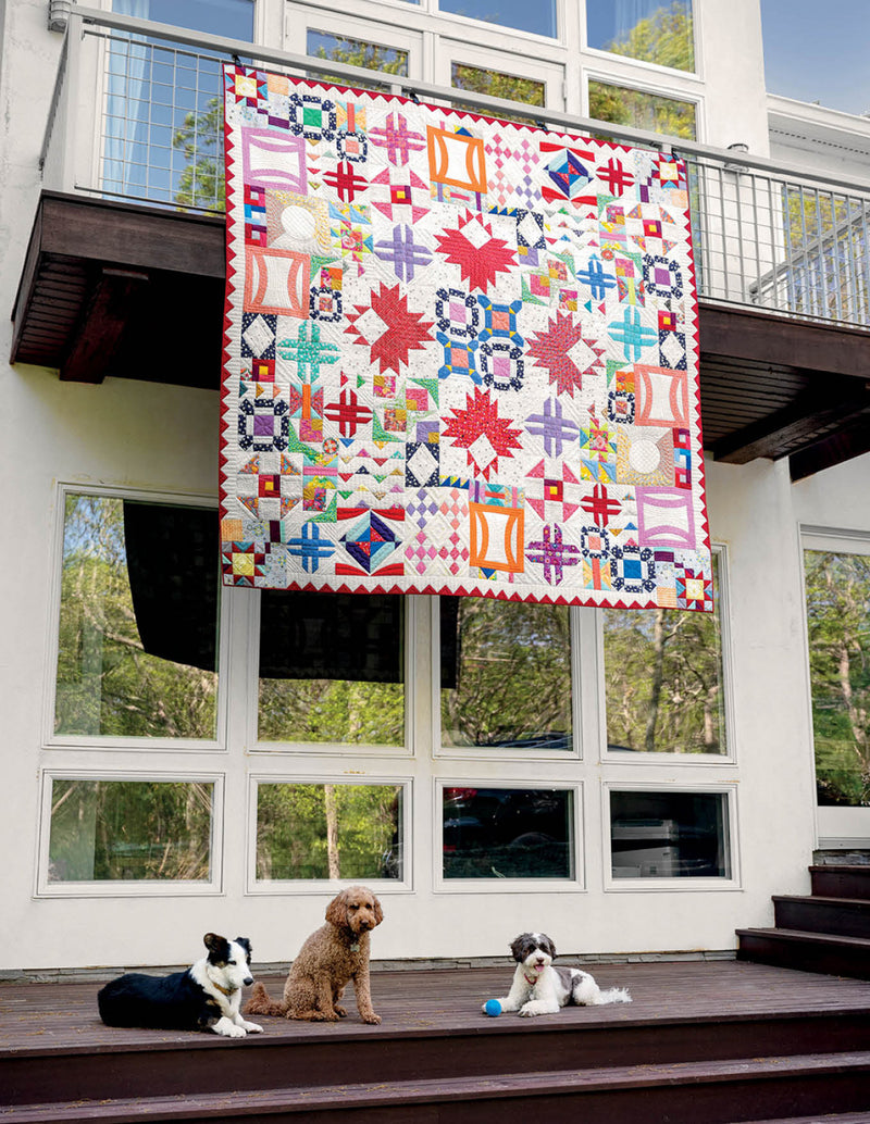 the quilting experience victoria findlay wolfe showing quilt hanging off balcony SF6807