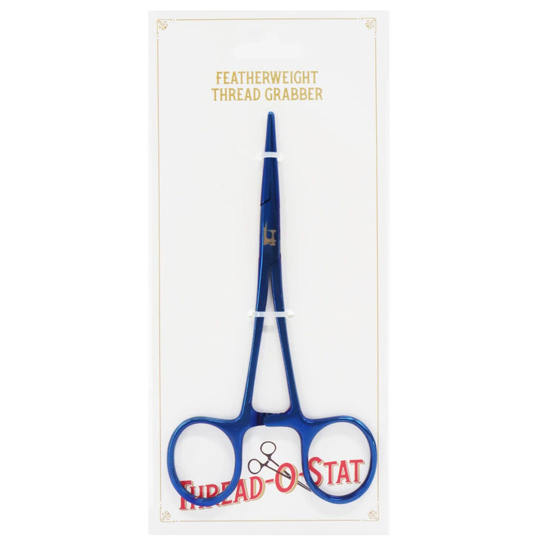 Thread-O-Stat Featherweight Thread Grabber - Blue on cardboard packaging