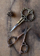Victorian Scrollwork Scissors in Antique Finish on wooden surface