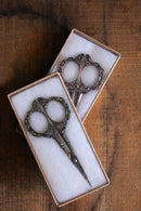 Victorian Scrollwork Scissors in Antique finish in gift boxes on wooden surface