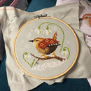 Wren & Snowdrops Cross Stitch  design in an embroidery hoop.