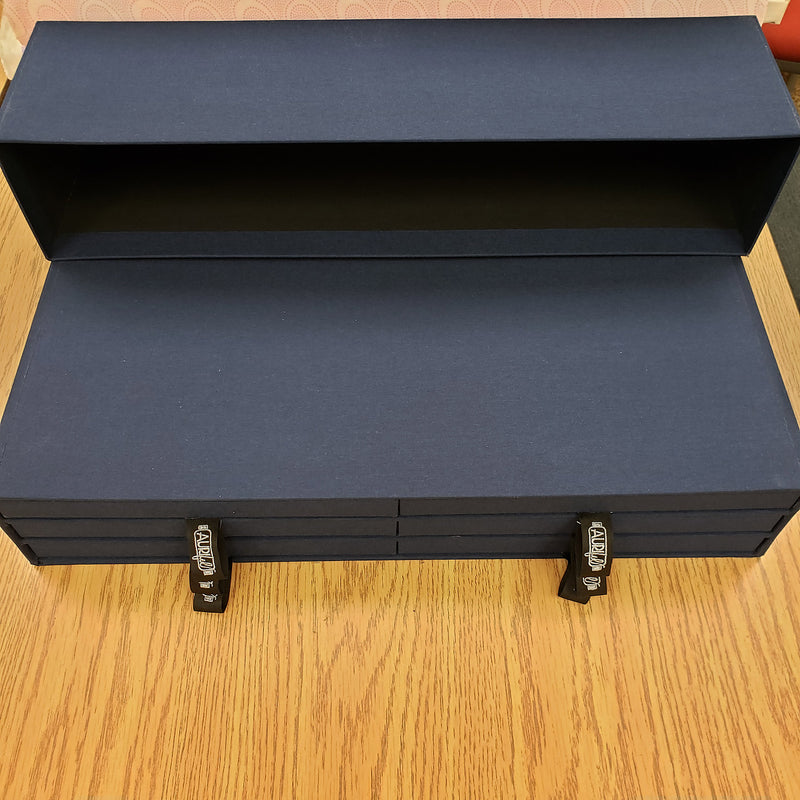 Aurifil storage case with lid off and drawers closed
